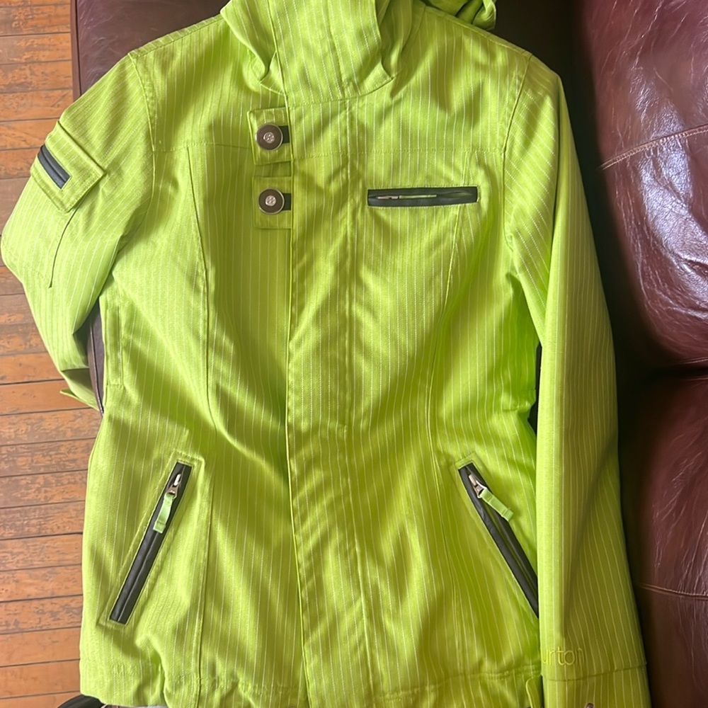 A gently used ski/snowboard jacket. It is a beautiful and bright green colour